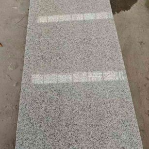 新乡芝麻白光面毛板